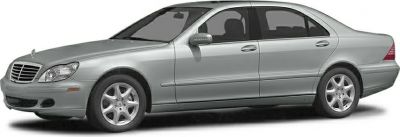 Silver luxury sedan with alloy wheels and signature grille