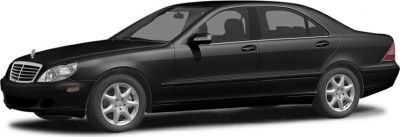 Black luxury sedan with alloy wheels and sleek design.