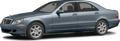 Extended luxury sedan with alloy wheels, four doors, and sleek side profile