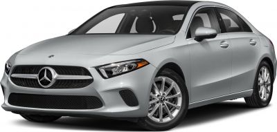 Sleek silver sedan front view with sharp headlights and alloy wheels