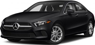 Front angle of black sedan showcasing headlamps and alloy wheels