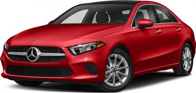 Sleek red sedan front with prominent grille and alloy wheels
