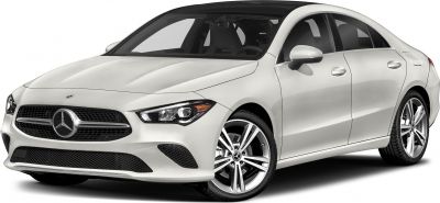 Sleek white luxury coupe front with distinctive grille and sharp headlights