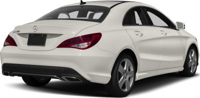Rear view of sleek coupe with distinctive taillights and dual exhausts