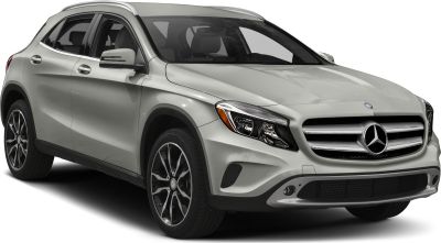Front view of luxury compact SUV with prominent grille and headlight design