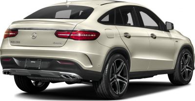 Rear coupe view with dual exhausts, taillights, and black alloy wheels