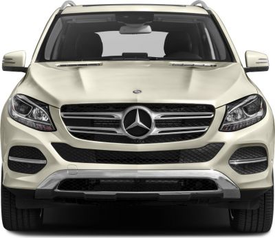 Close-up of SUV front with LED headlights and distinctive grille.