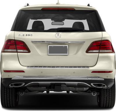 Rear view with tail lights, chrome trim, and dual exhausts