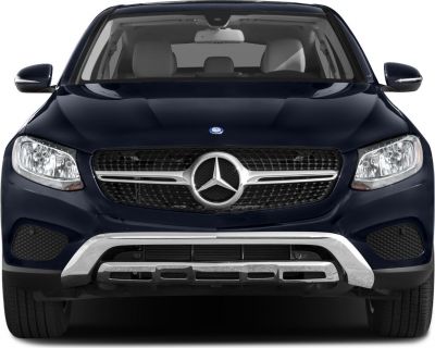 Front grille with star emblem, headlights, and lower bumper styling