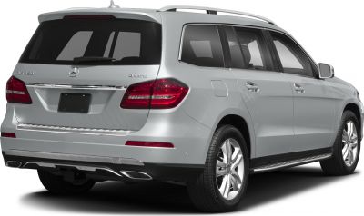 Rear side profile with taillights, roof rails, bumper, and alloy wheels.