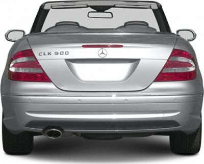 Rear view of convertible with taillights, trunk details, and single exhaust