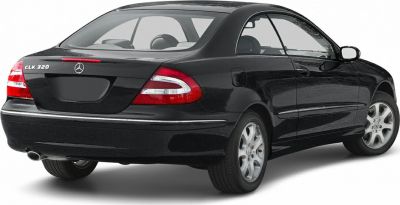 Rear view of black coupe with tail lights and alloy wheels