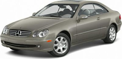 Front and side view of a coupe with rounded headlights and alloy wheels