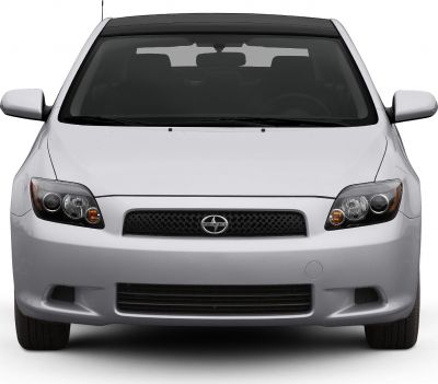 Front view with distinctive headlights and honeycomb grille