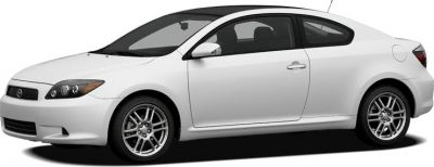 Side profile of white two-door coupe with alloy wheels