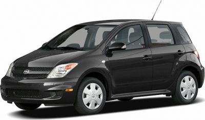 Front side view of a compact hatchback with classic styling.