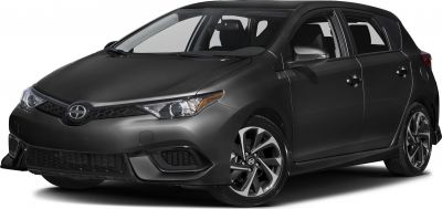 Compact hatchback front-side view with sharp headlights and alloy wheels