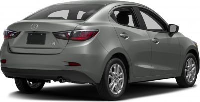 Rear and side view of a 2016 compact sedan with distinctive tail lights and alloy wheels