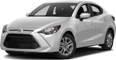 Sharp headlights and large front grille of a subcompact sedan