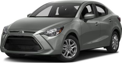 Compact hatchback front side view with sleek headlights and silver paint.