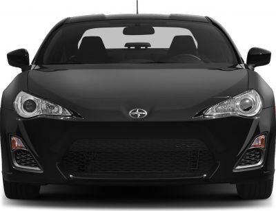 Sporty coupe with aggressive headlights and wide grille front view
