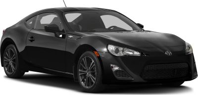 Front side view of black sports coupe with sleek headlights and alloy wheels
