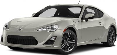 Front side view of sporty coupe with alloy wheels in light gray.