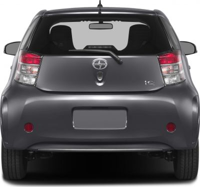 Rear view showing hatchback taillights, rear window, and bumper.