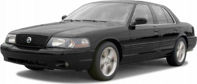 Black sedan front side view with alloy wheels and clear headlights