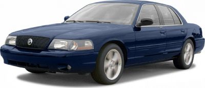 Front three-quarter view of a dark blue four-door sedan with alloy wheels