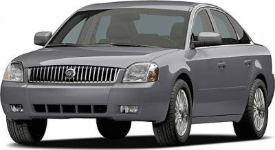 Front-side view with chrome vertical-bar grille and rectangular headlights