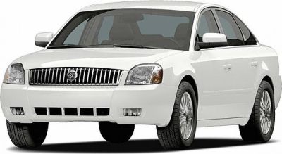 White sedan front view with distinctive grille and headlights