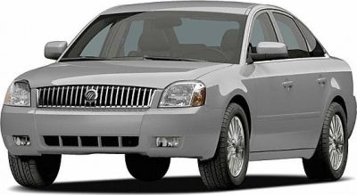 Front view of a sedan with chrome vertical grille and sleek body design