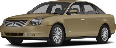 Front side view of a gold mid-size sedan with distinct grille and headlamps
