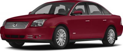 Red sedan with prominent grille and front three-quarter view.
