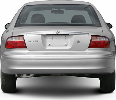 Rear view of a sedan with distinct tail lights and trunk emblem