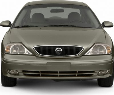 Front view with distinctive headlights and chrome-accented grille