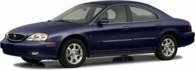 Side profile of a four-door sedan with alloy wheels
