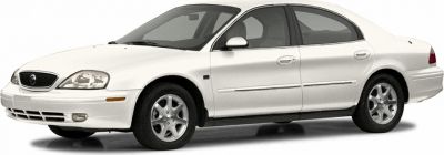 White sedan front side profile with alloy wheels
