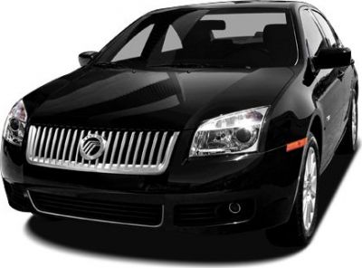 Bold front grille and clear headlights on a sleek black sedan