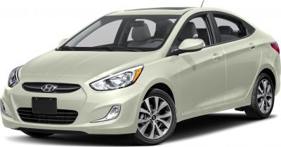 Front side view of a sedan with alloy wheels and modern headlights