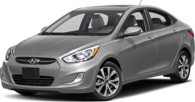 Front-side view with headlights and alloy wheels of gray sedan