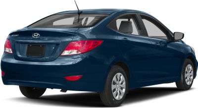 Rear and side view of a compact four-door sedan with distinctive rear lights