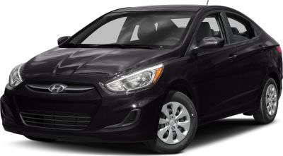Compact sedan front-side view with aerodynamic design and clear headlights.