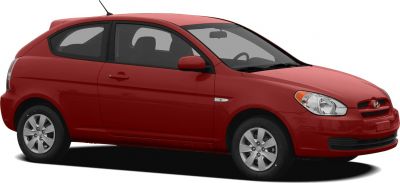 Compact red 3-door hatchback with smooth contours and alloy wheels.