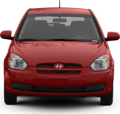 Red hatchback front with headlights and emblem