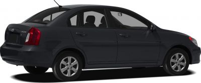 Side view of black compact sedan with alloy wheels