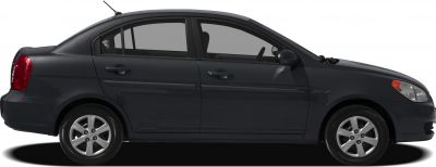 Side profile of a compact sedan with alloy wheels and four doors
