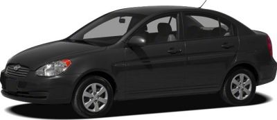 Side profile of a black four-door compact sedan