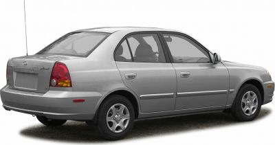 Rear side profile of a compact sedan with distinctive taillights
